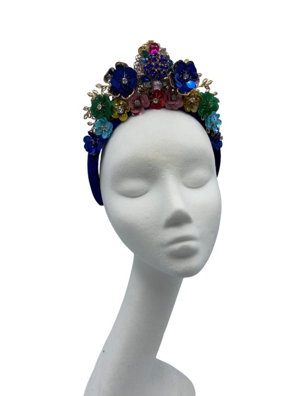 Stunning blue velvet headpiece with an array of coloured embellishments.